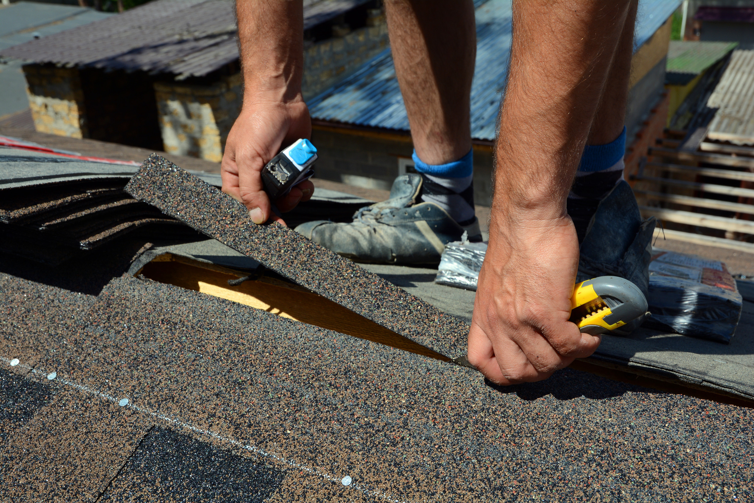Repair of a Roofing from shingles. Roofing cutting roofing. Roof Shingles - Roofing. Bitumen tile roof.